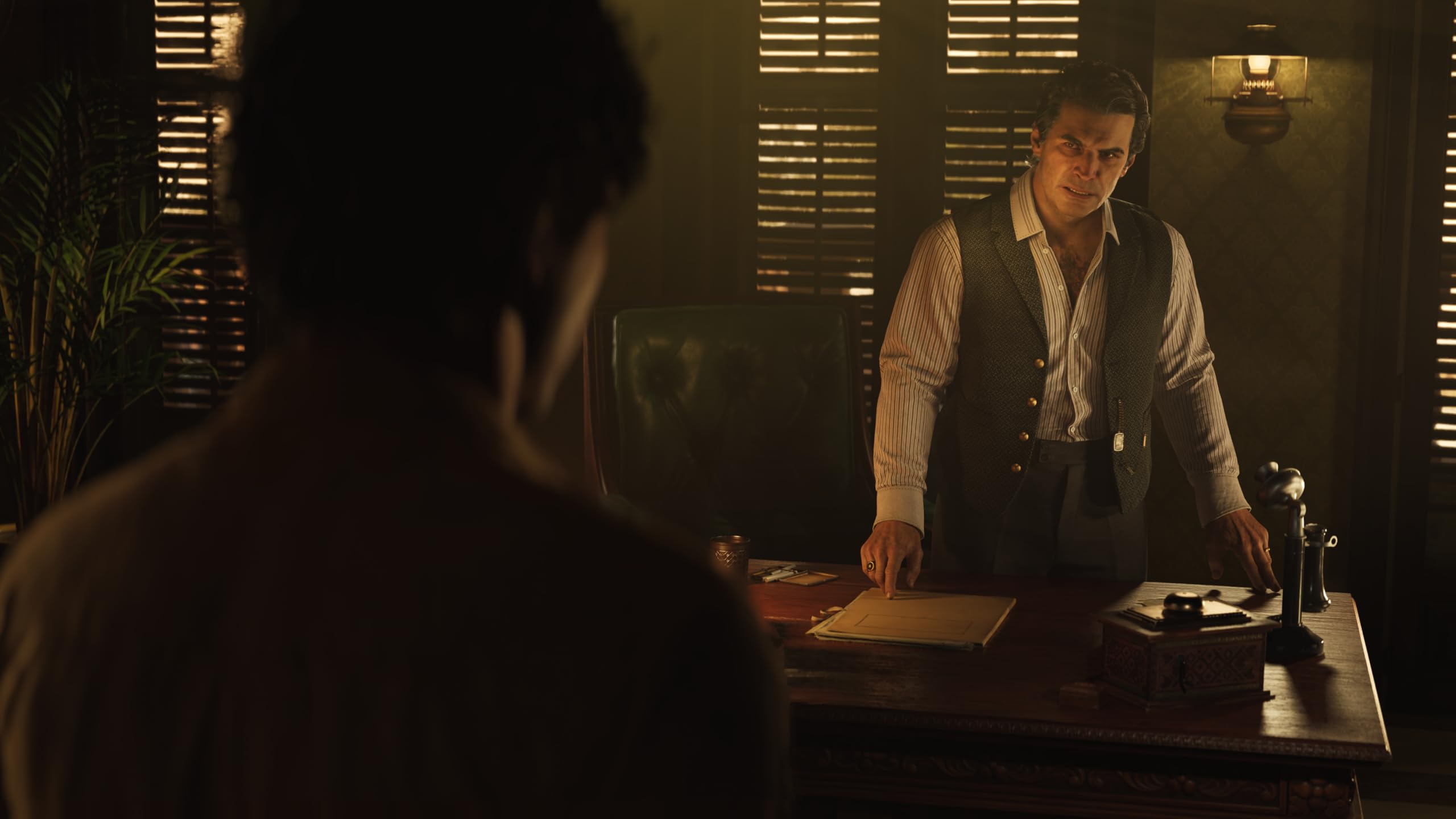 Mafia The Old Country PS5 game scene showing a man in a vest standing behind a desk in a dimly lit office