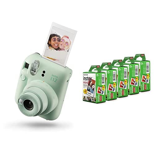 Fujifilm Instax Mini 12 instant camera in mint green with printed photo and film packs