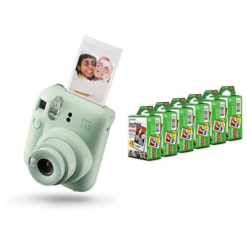 Mint green Fujifilm Instax Mini 12 instant camera with instant photo and six packs of Fujifilm instant film