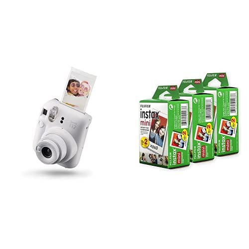 White Fujifilm Instax Mini 12 instant camera with printed photo and three packs of Fujifilm Instax Mini film
