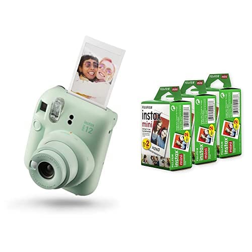 Fujifilm Instax Mini 12 instant camera in mint green with instant photo and film packs