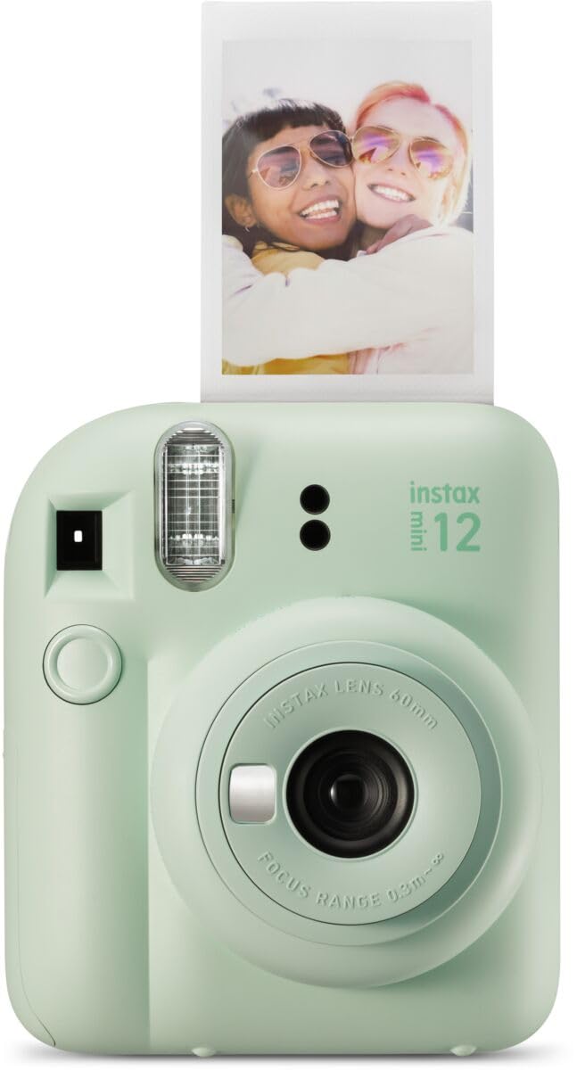 Mint green Fujifilm Instax Mini 12 instant camera with instant photo of two smiling friends
