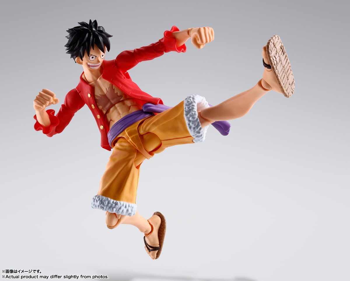 Monkey D. Luffy action figure by craques in dynamic kicking pose with red jacket and yellow shorts