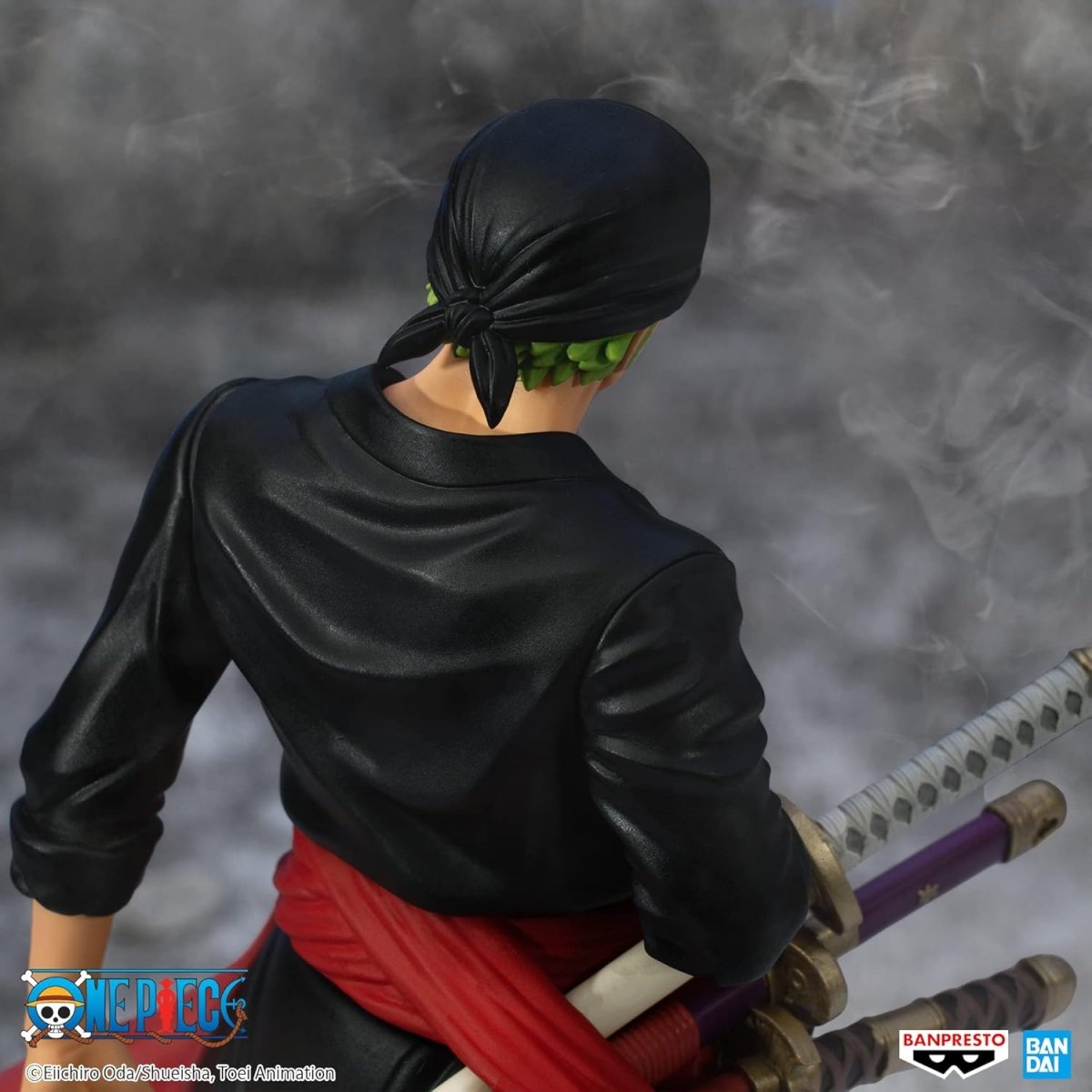 Banpresto One Piece Zoro figure with black bandana and red sash holding three swords from craques