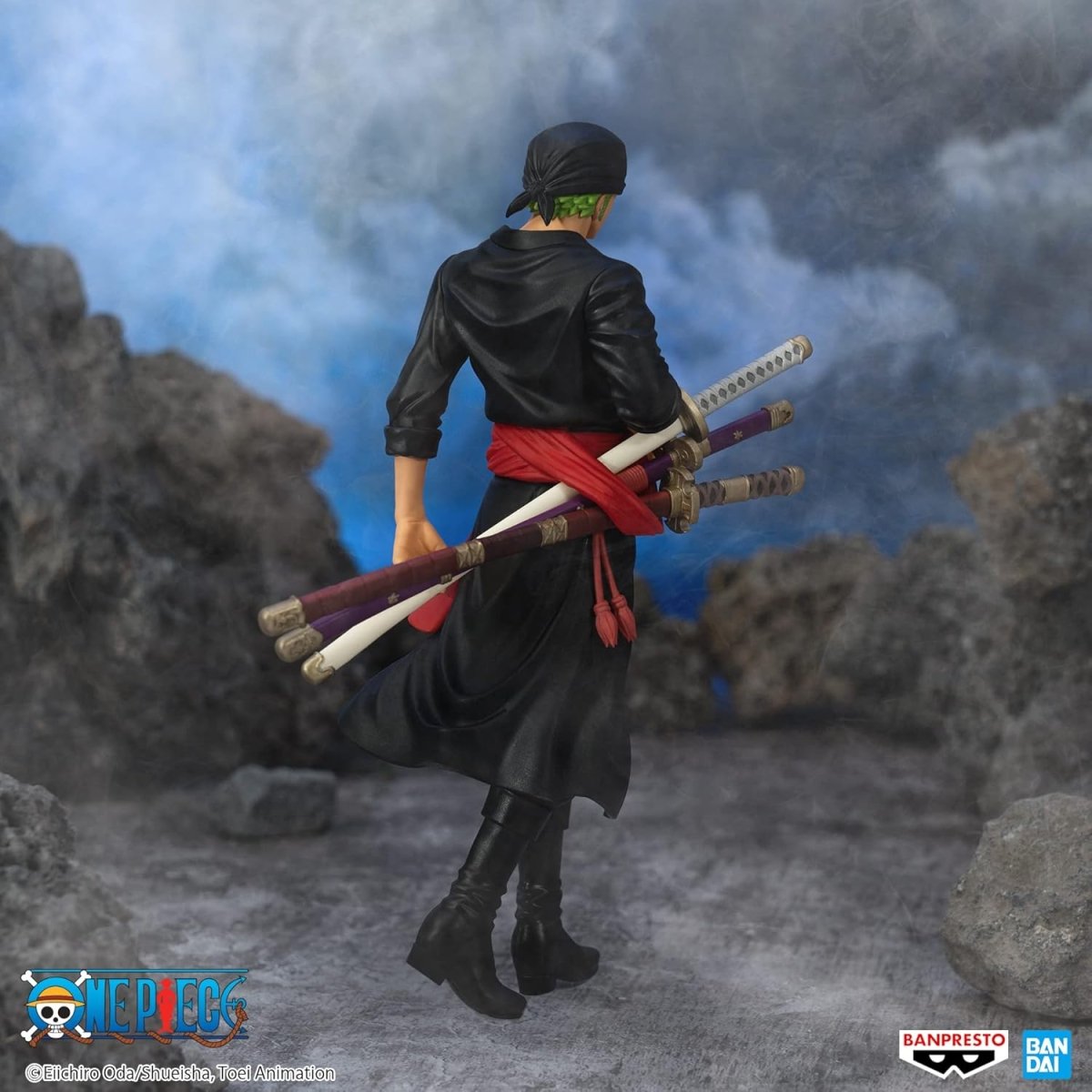 Banpresto One Piece Zoro figure in black outfit with three swords and red sash on rocky background