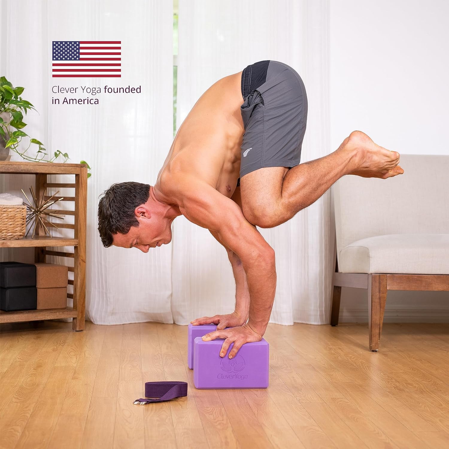 Man performing advanced yoga pose using lightweight foam yoga blocks indoors