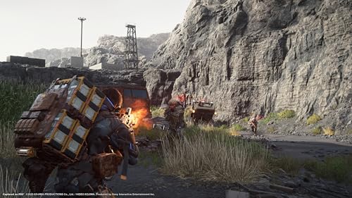Gameplay scene from Death Stranding 2 Collector's Edition PS5 showing character carrying heavy cargo in rocky outdoor environment