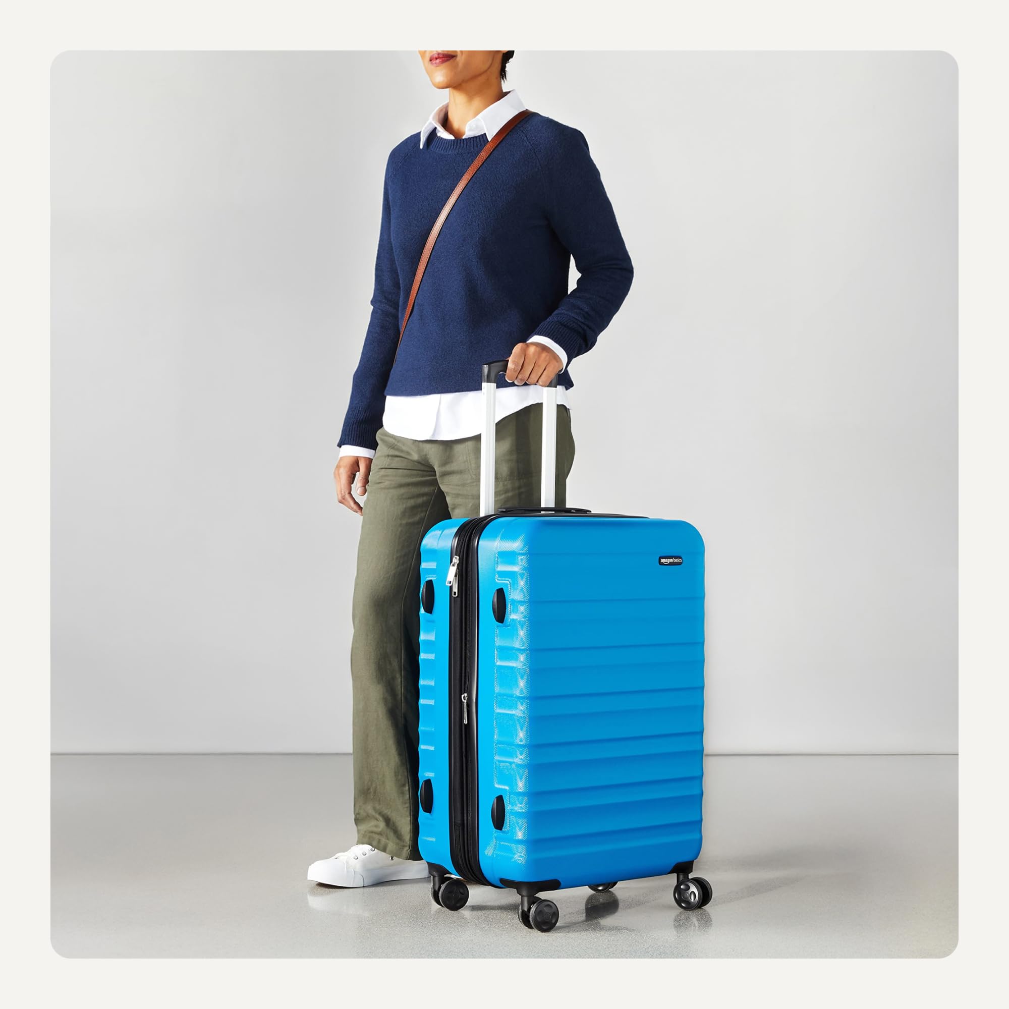 Craques blue expandable hardshell luggage set with four wheels and telescoping handle