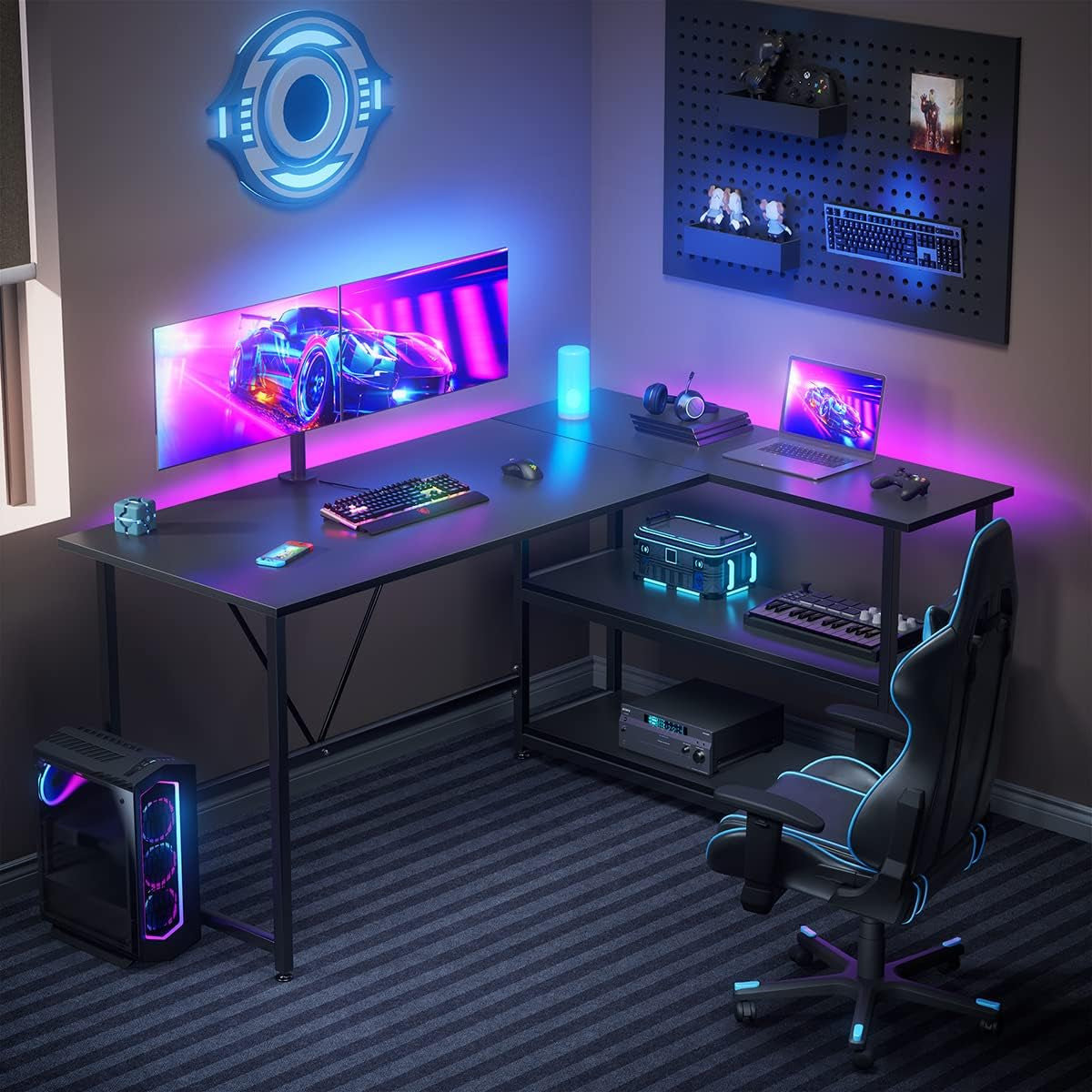 L shaped gaming desk with shelves in black setup with dual monitors RGB lighting and gaming accessories