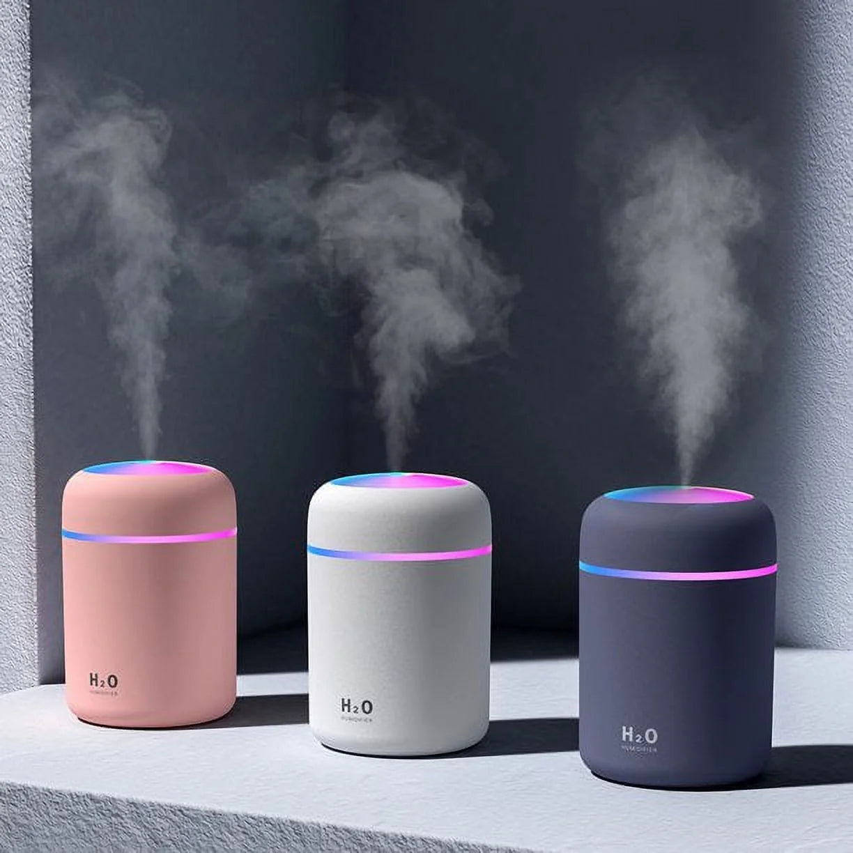 Craques portable mini humidifier in pink white and black with colorful LED light and mist output