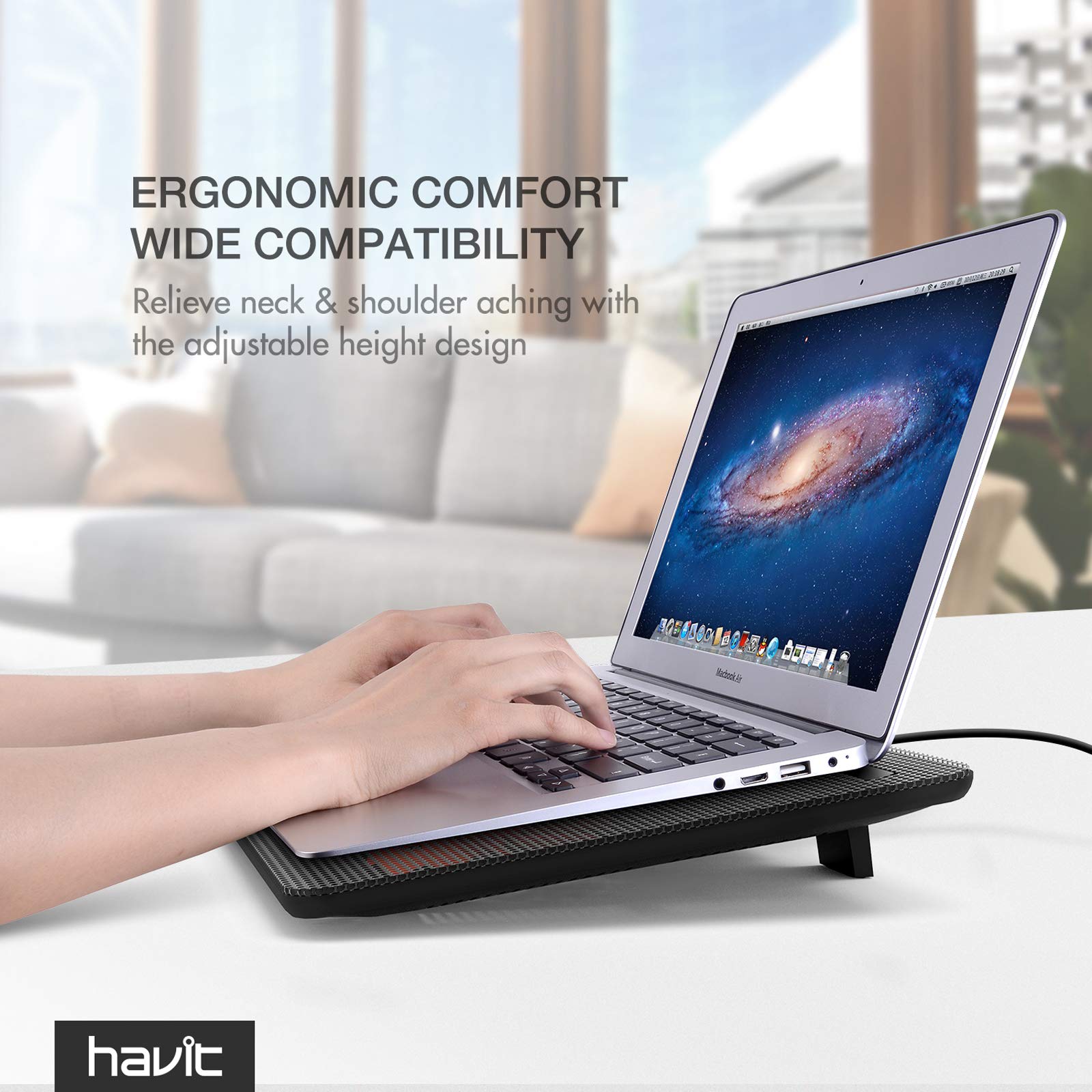 Havit laptop cooling pad under silver laptop showing ergonomic comfort and adjustable height design