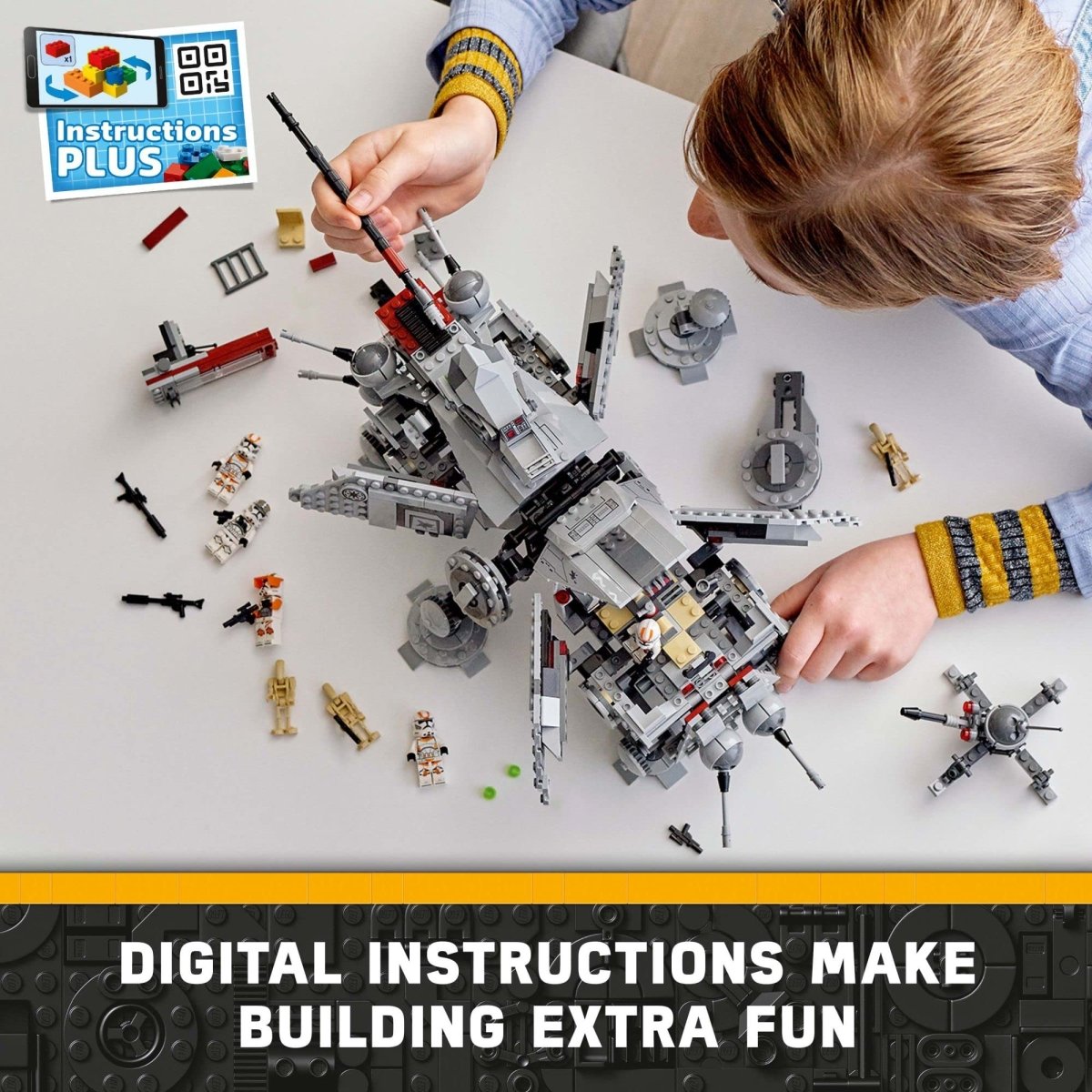 Person assembling LEGO Star Wars AT-TE Walker set with digital instructions and minifigures