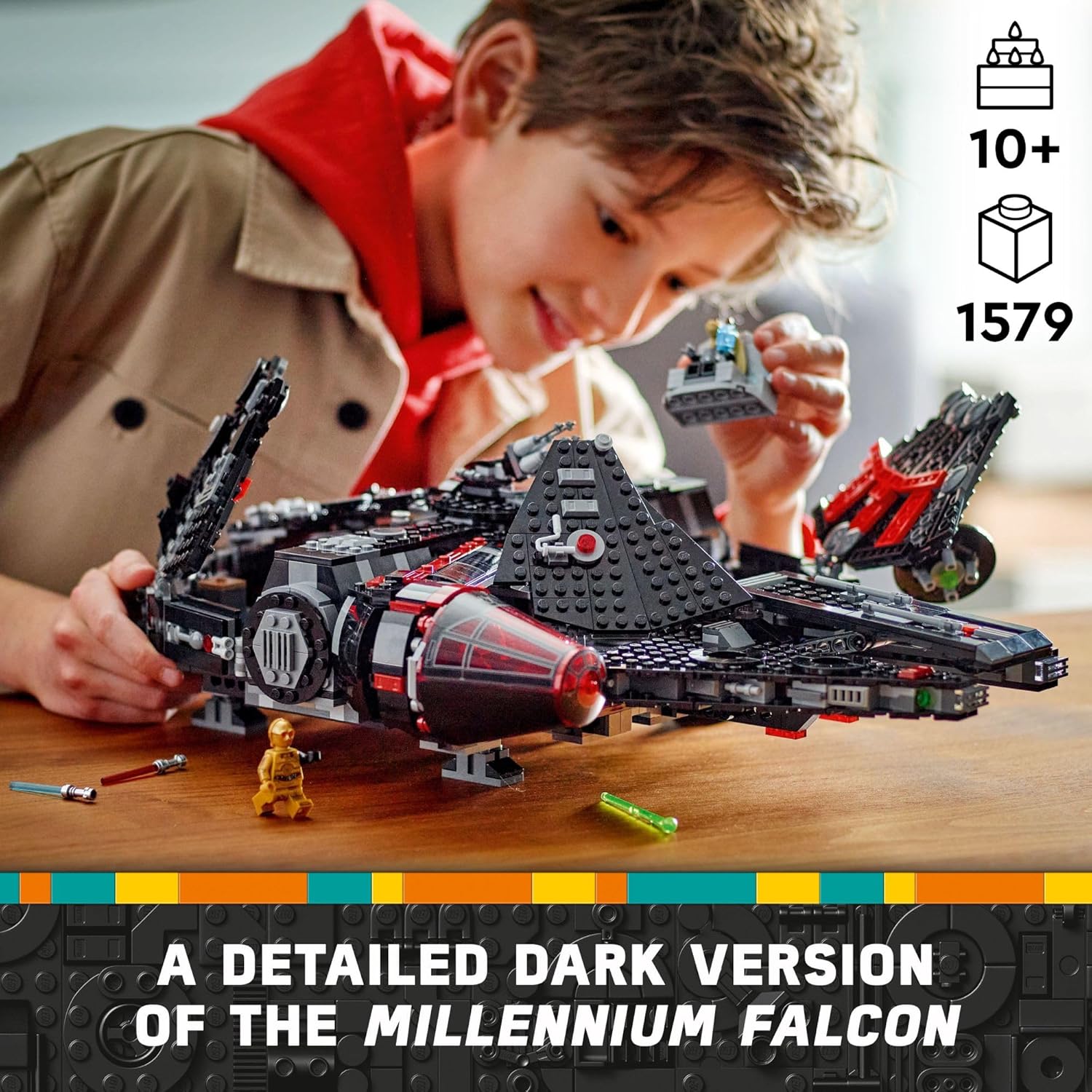 Child playing with the LEGO Star Wars The Dark Falcon set featuring a detailed dark Millennium Falcon model