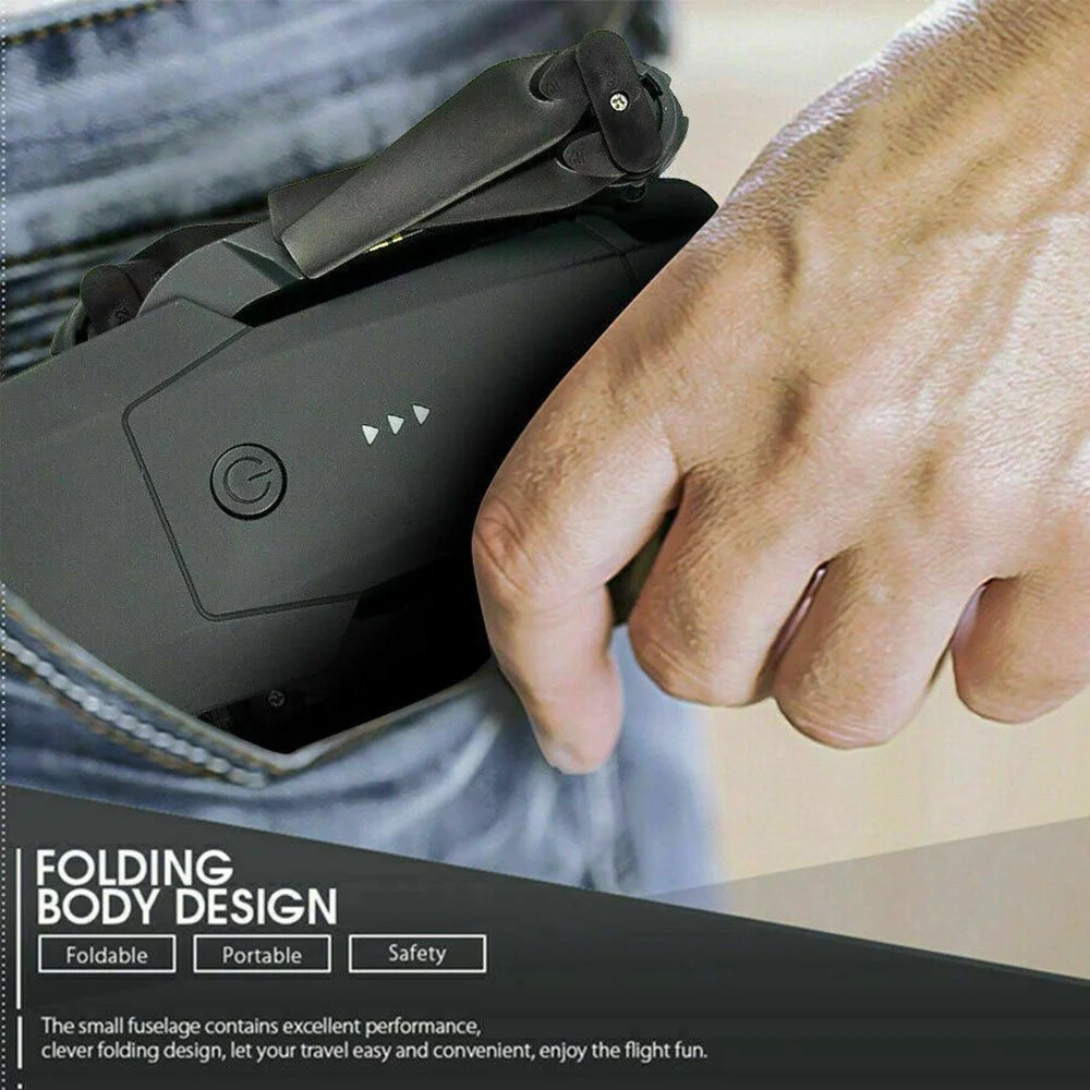 Foldable black 4K camera drone for adults being placed into a pocket showing portable and compact design