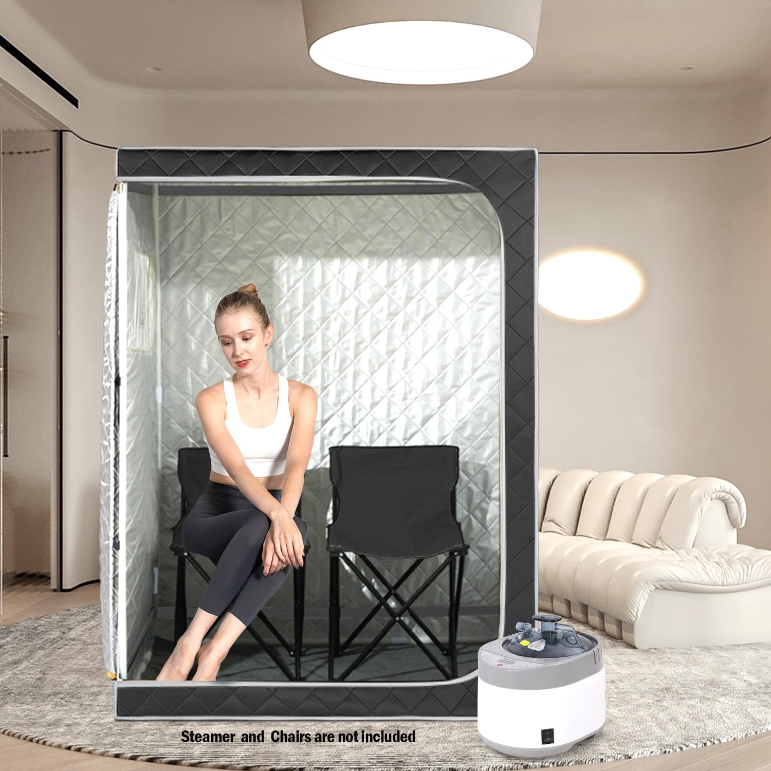 Craques full size steam sauna tent with a woman sitting inside on a chair in a modern living room