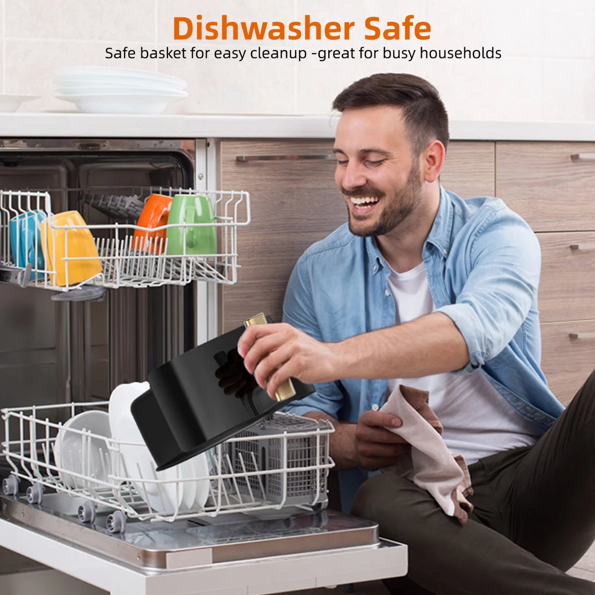 Man loading removable basket of 5.2QT air fryer oven into dishwasher for easy cleaning