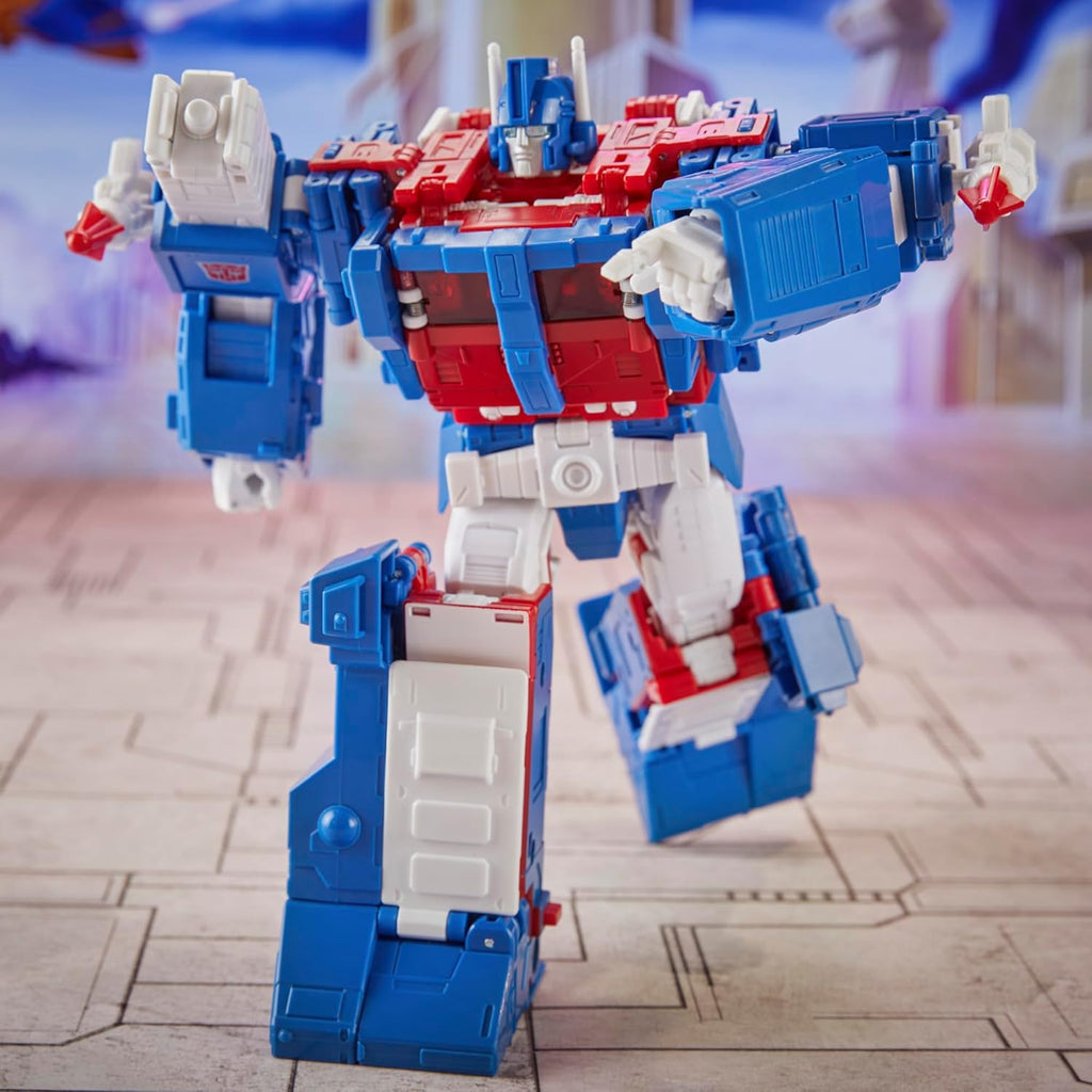 Transformers Ultra Magnus action figure in red white and blue colors posed dynamically on a city-themed background