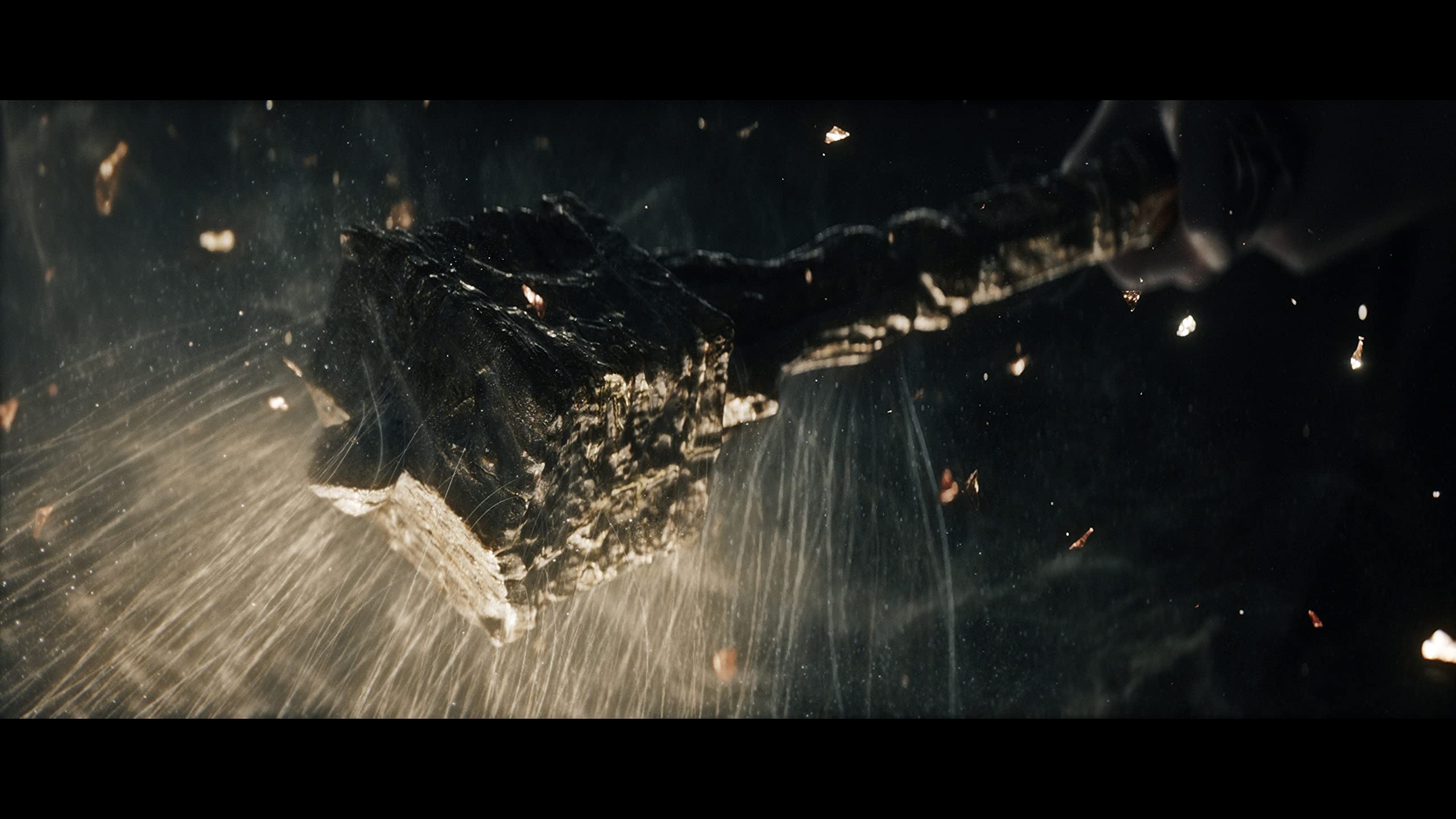 Dark fantasy weapon splashing through water in an intense scene from Elden Ring PS5