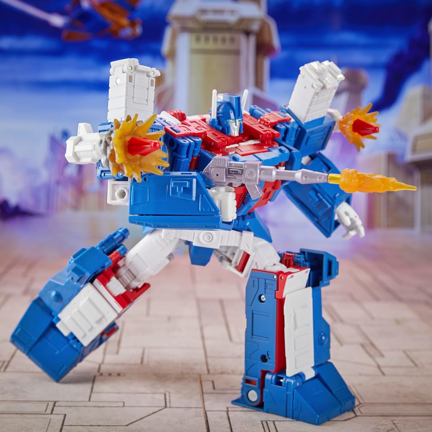 Transformers Ultra Magnus action figure by craques in blue red and white firing weapons with city background