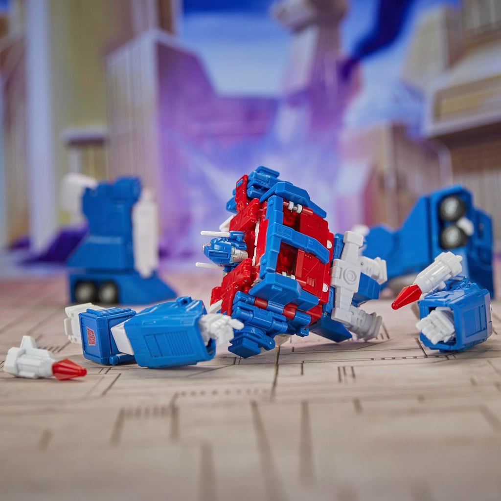 Transformers Ultra Magnus action figure in red white and blue colors with detailed design on wooden floor