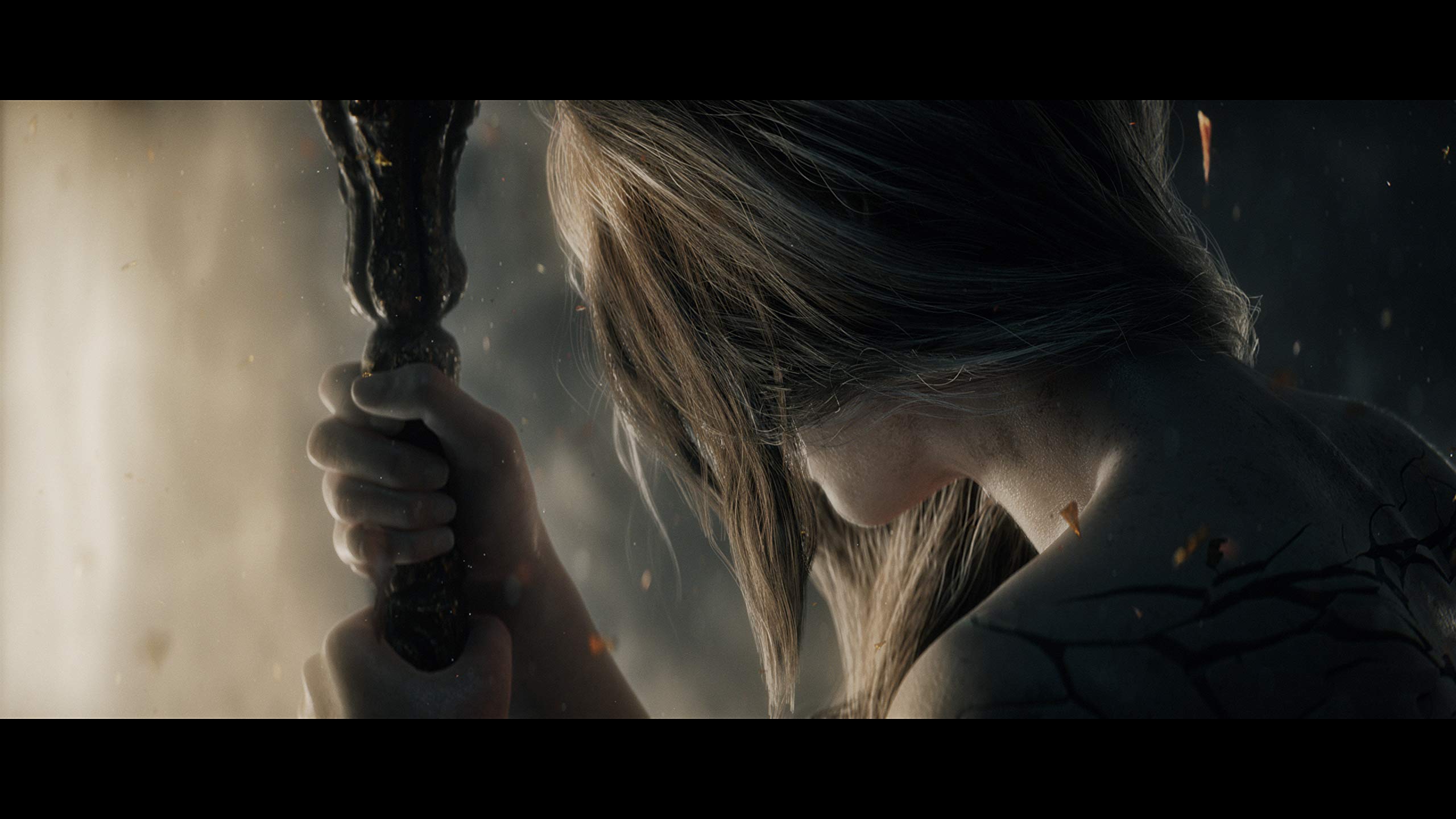 Close-up of a character holding a dark textured staff in Elden Ring PS5 game scene with dramatic lighting