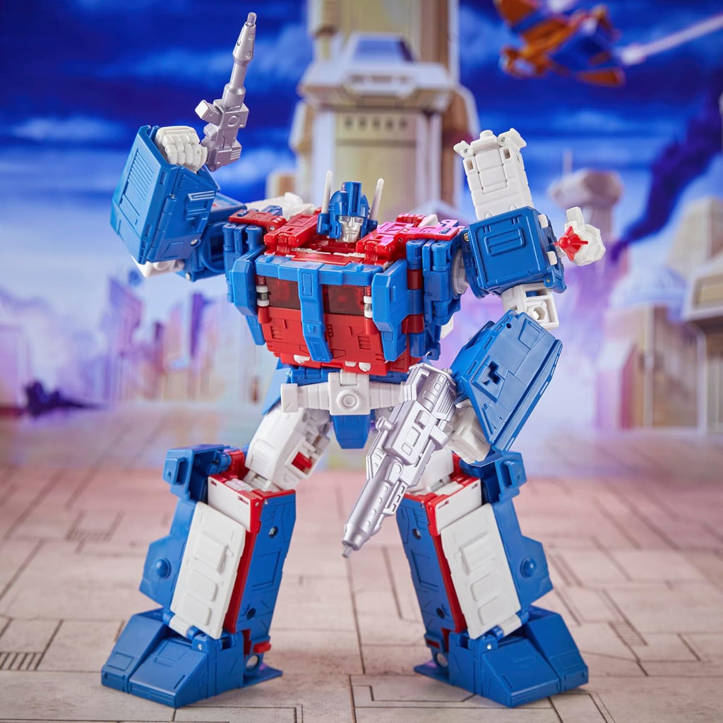 Transformers Ultra Magnus action figure in red white and blue with weapons posed in futuristic city backdrop