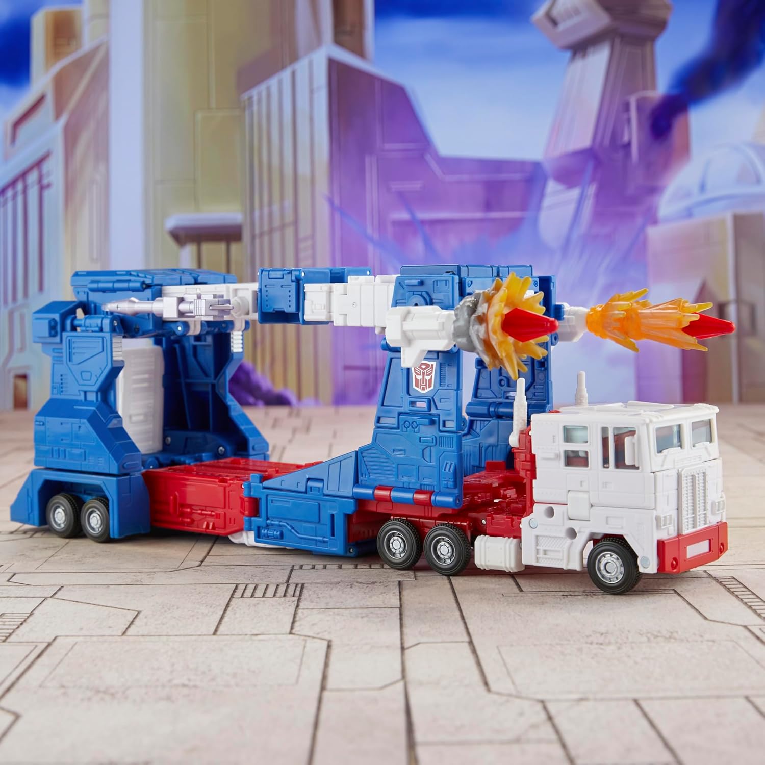 Transformers Ultra Magnus action figure in blue and white truck mode firing orange missile with city background