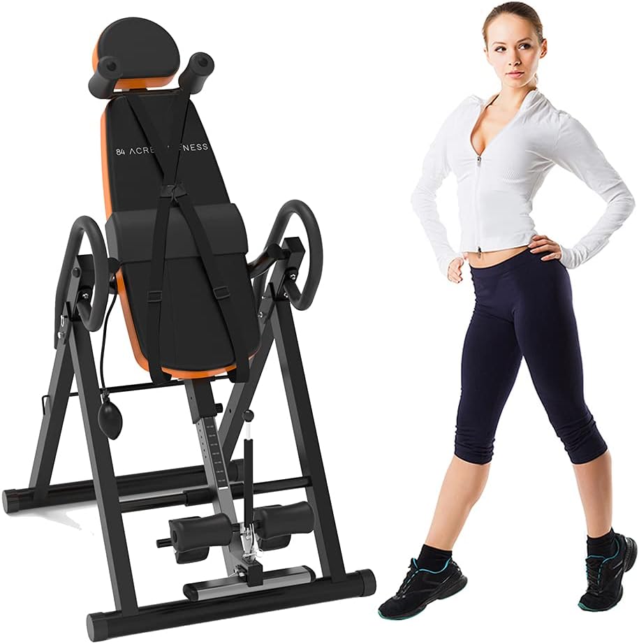 Craques heavy duty inversion table with padded backrest and safety straps next to woman in workout clothes