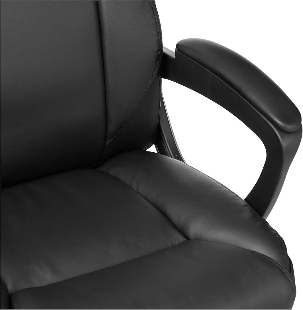 Close-up of black ergonomic office chair padded seat and armrest with smooth leather finish