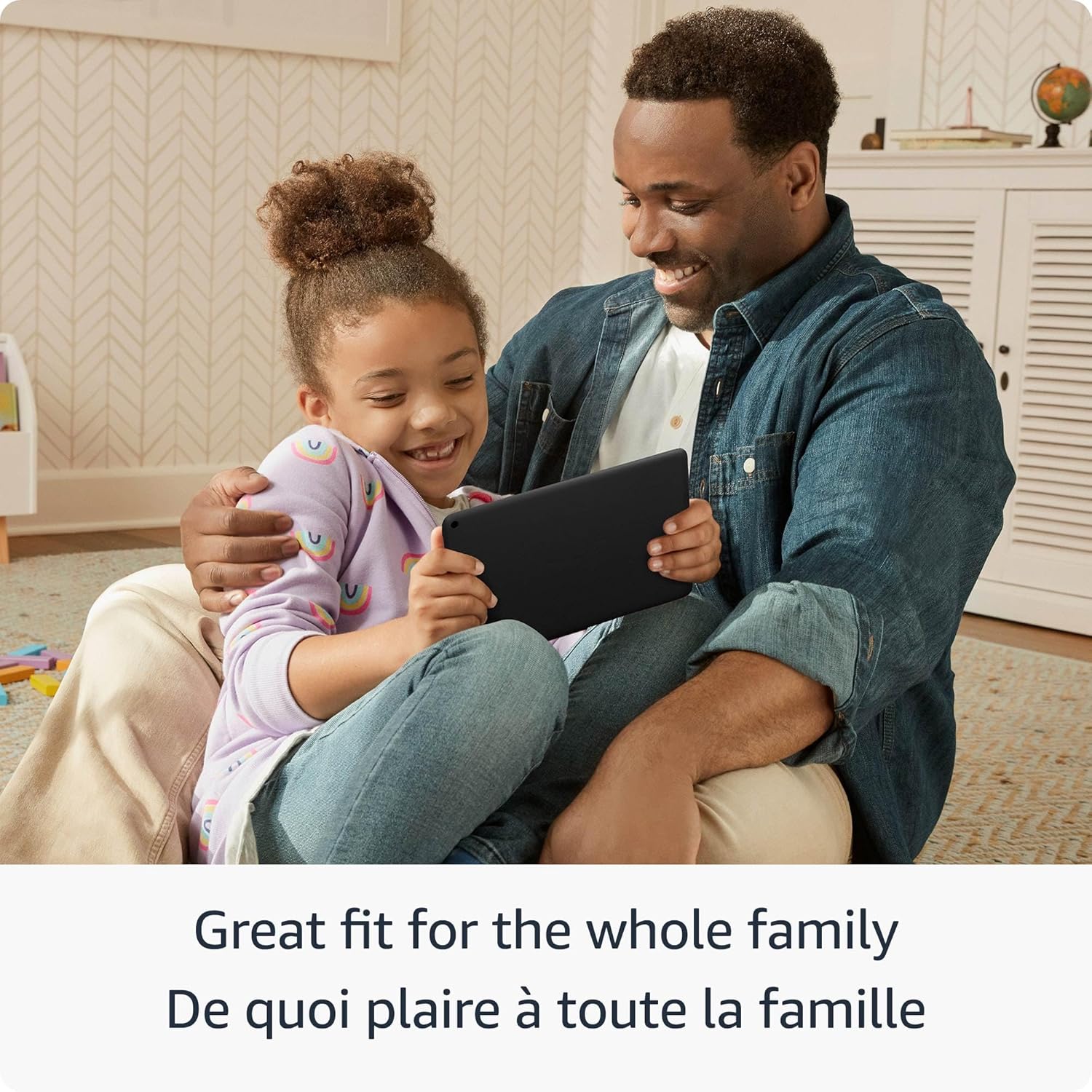 Father and daughter smiling using Amazon Fire HD 8 tablet together at home for family fun