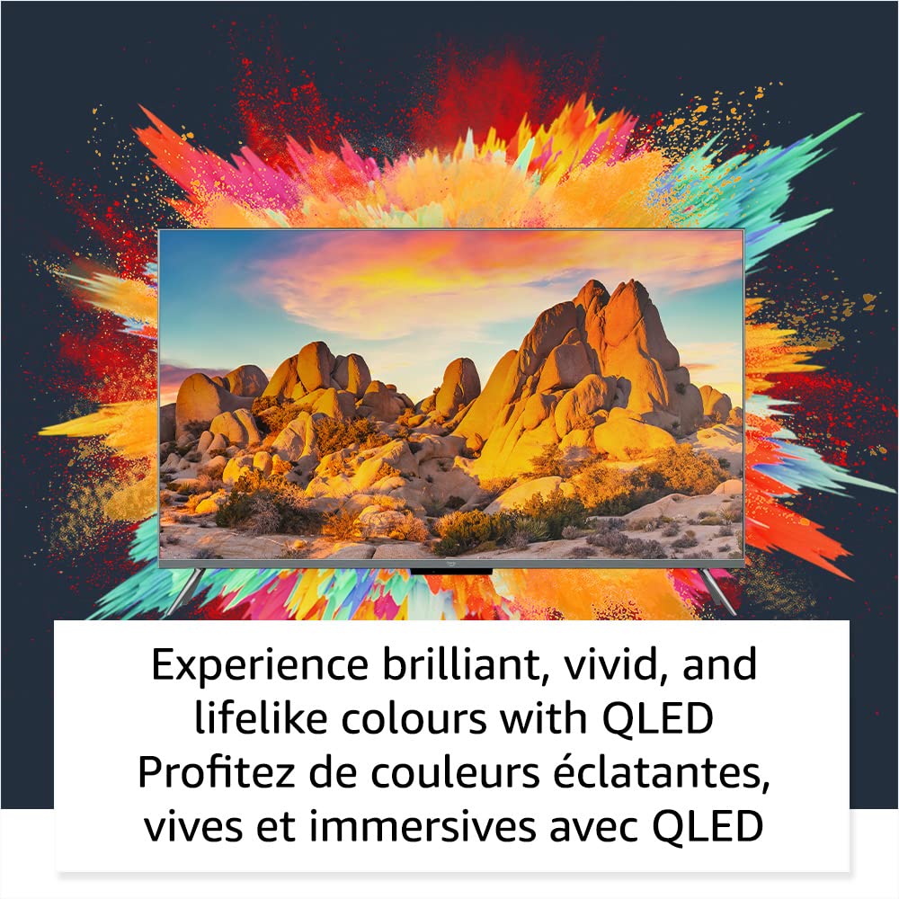 Amazon Fire TV 50 inch QLED displaying vivid desert landscape with vibrant colorful splash background