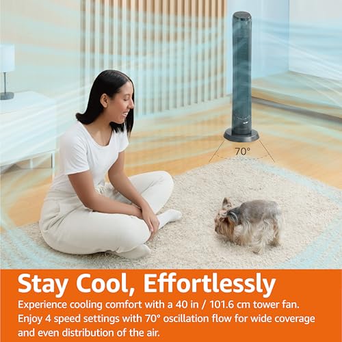 Oscillating tower fan with remote in living room cooling woman and small dog with 70 degree airflow