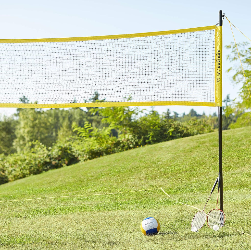 Craques outdoor volleyball and badminton set showing net, volleyball, and two badminton rackets on grass