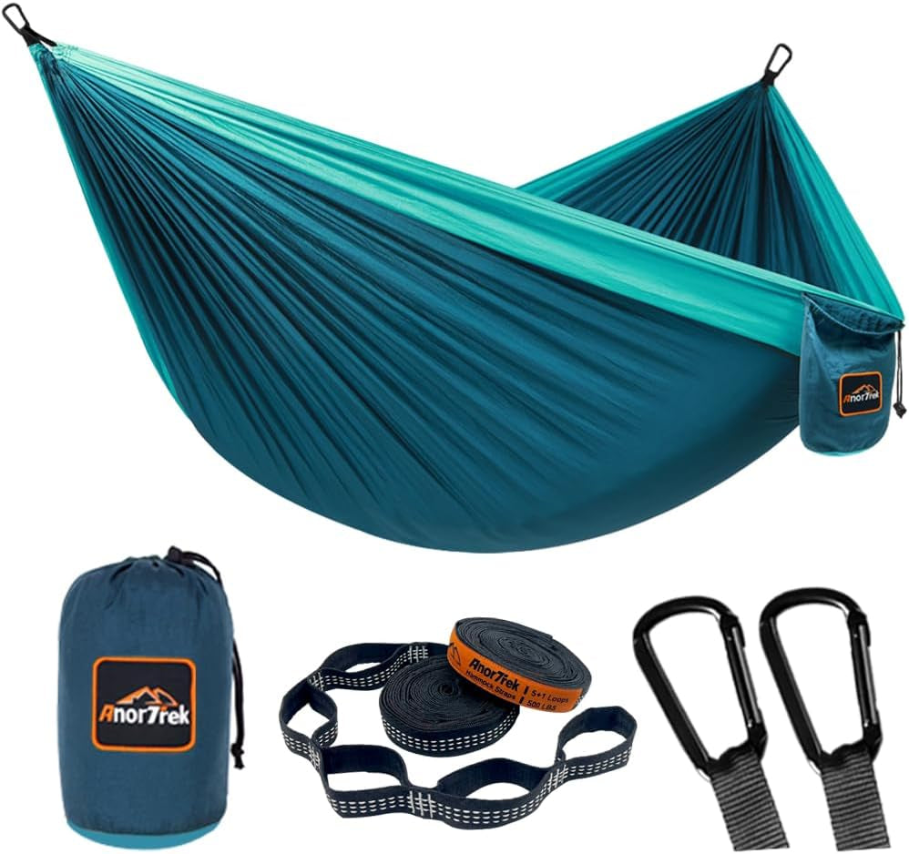 Craques lightweight camping hammock in blue with carrying bag, straps, and carabiners for outdoor use