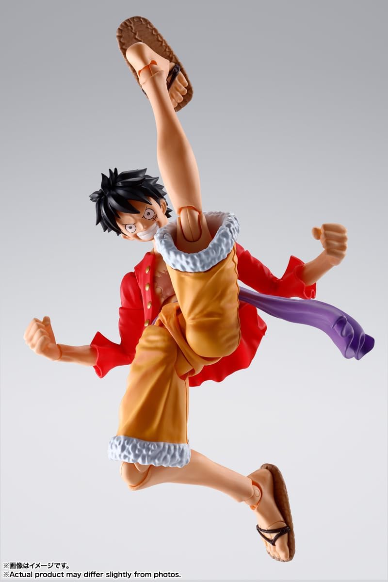 Monkey D. Luffy action figure by craques in dynamic kicking pose with red jacket and orange shorts
