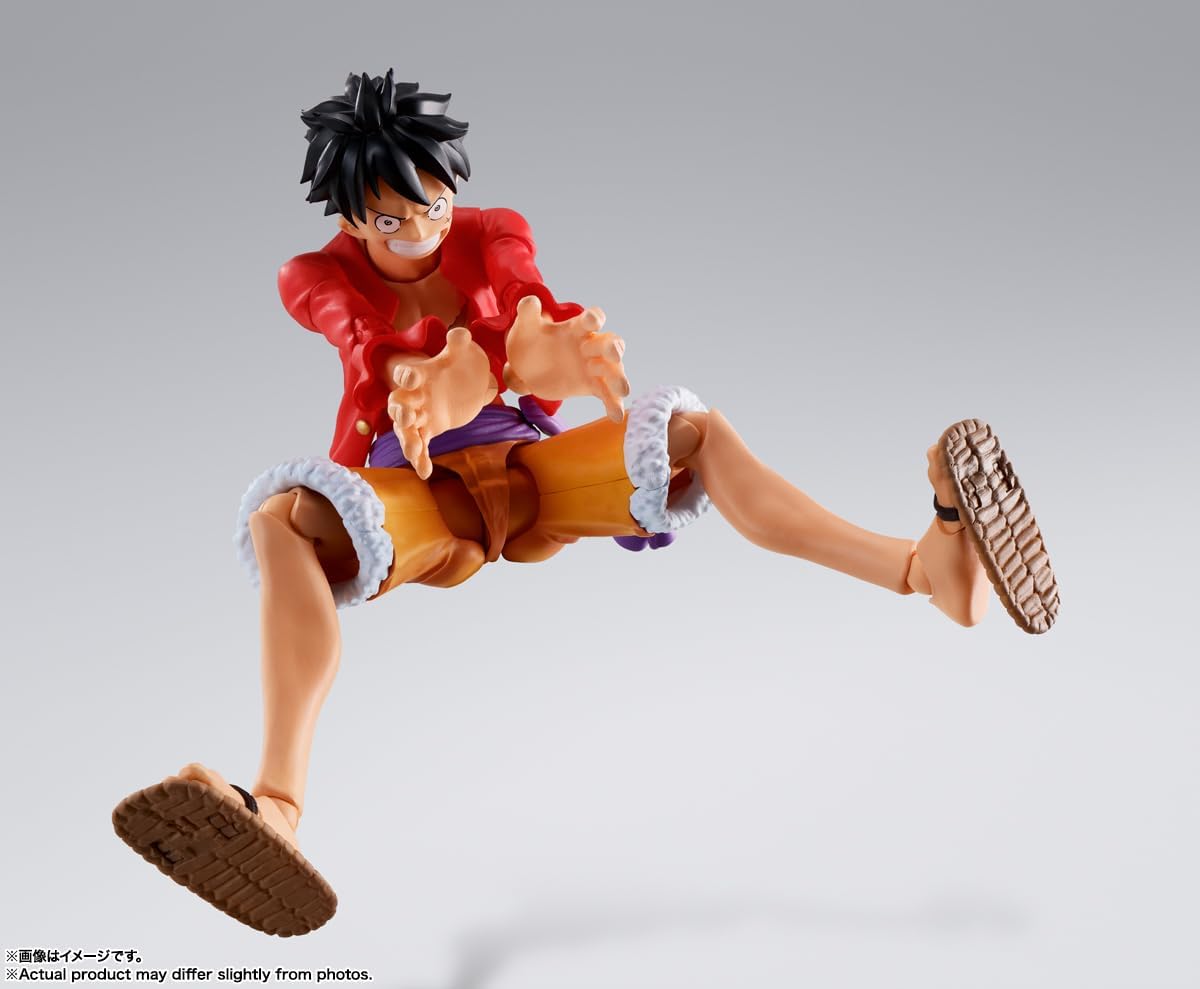 Monkey D. Luffy action figure by craques in dynamic pose wearing red jacket and orange shorts