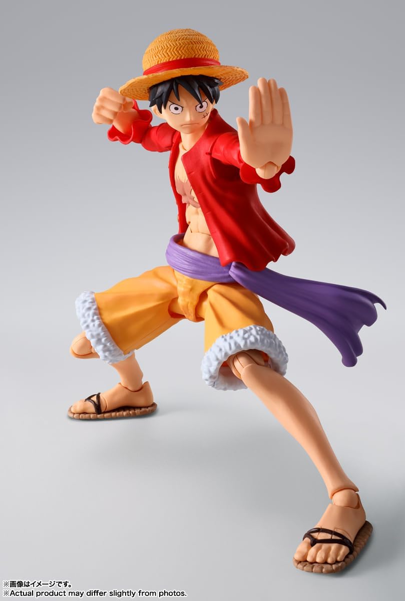 Monkey D. Luffy action figure by craques in dynamic martial arts pose wearing signature straw hat and red jacket