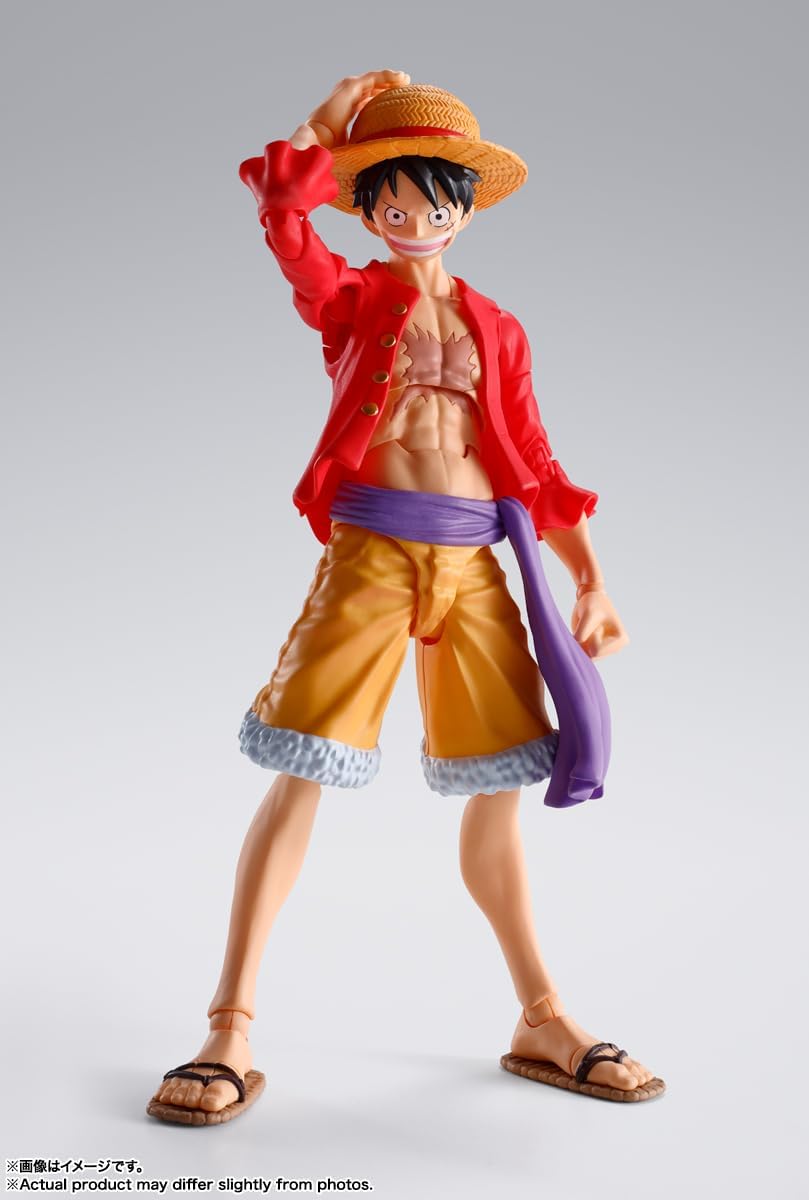Monkey D. Luffy action figure by Craques wearing a red jacket and straw hat in a dynamic pose