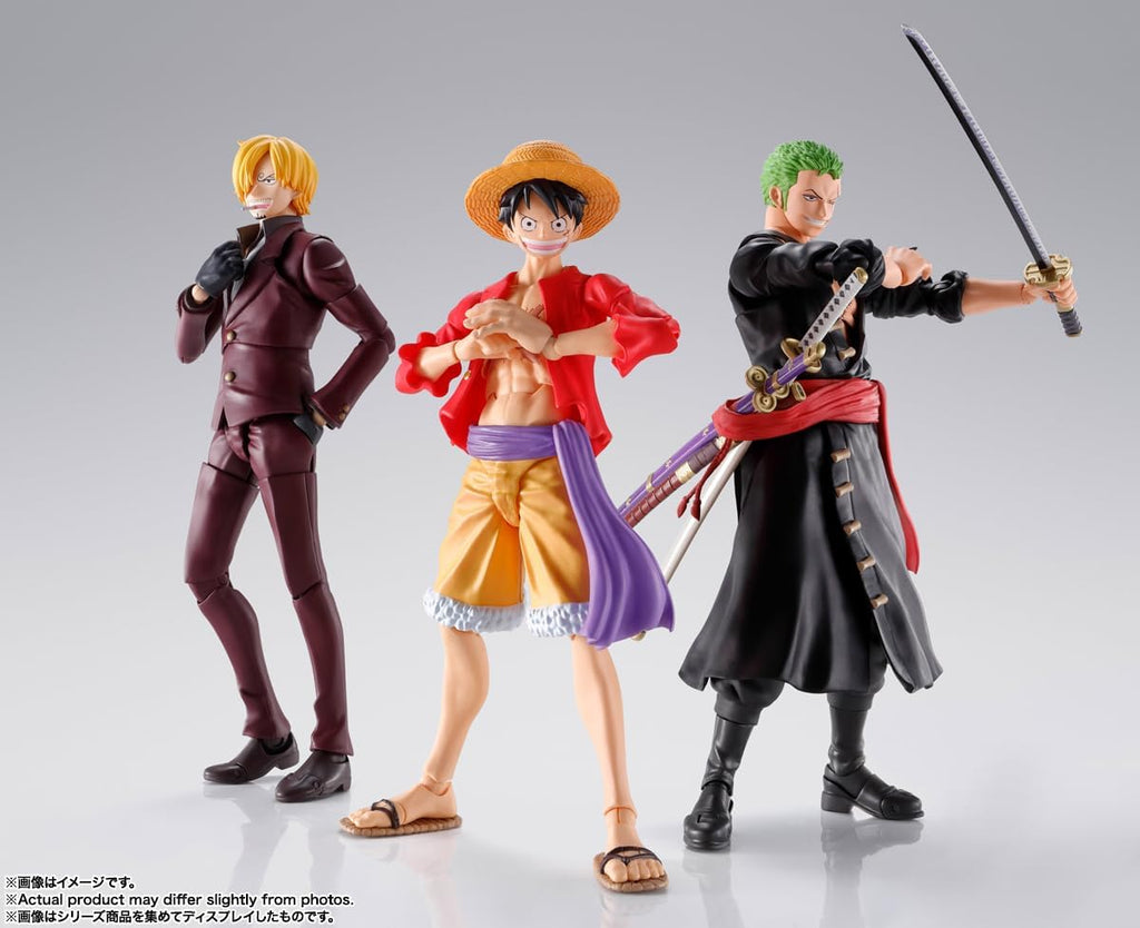 Monkey D. Luffy action figure by craques standing between two anime character figures with detailed costumes and poses