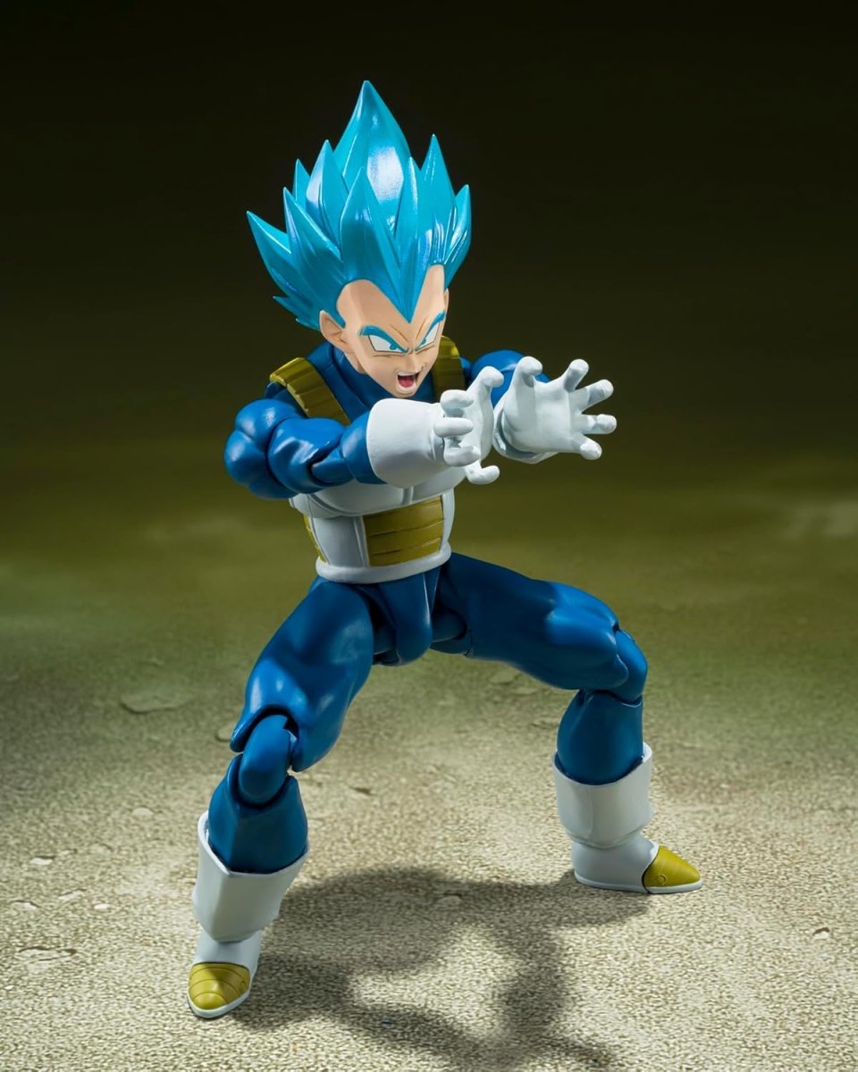 Craques Super Saiyan God Vegeta action figure in blue armor with glowing blue hair in battle pose