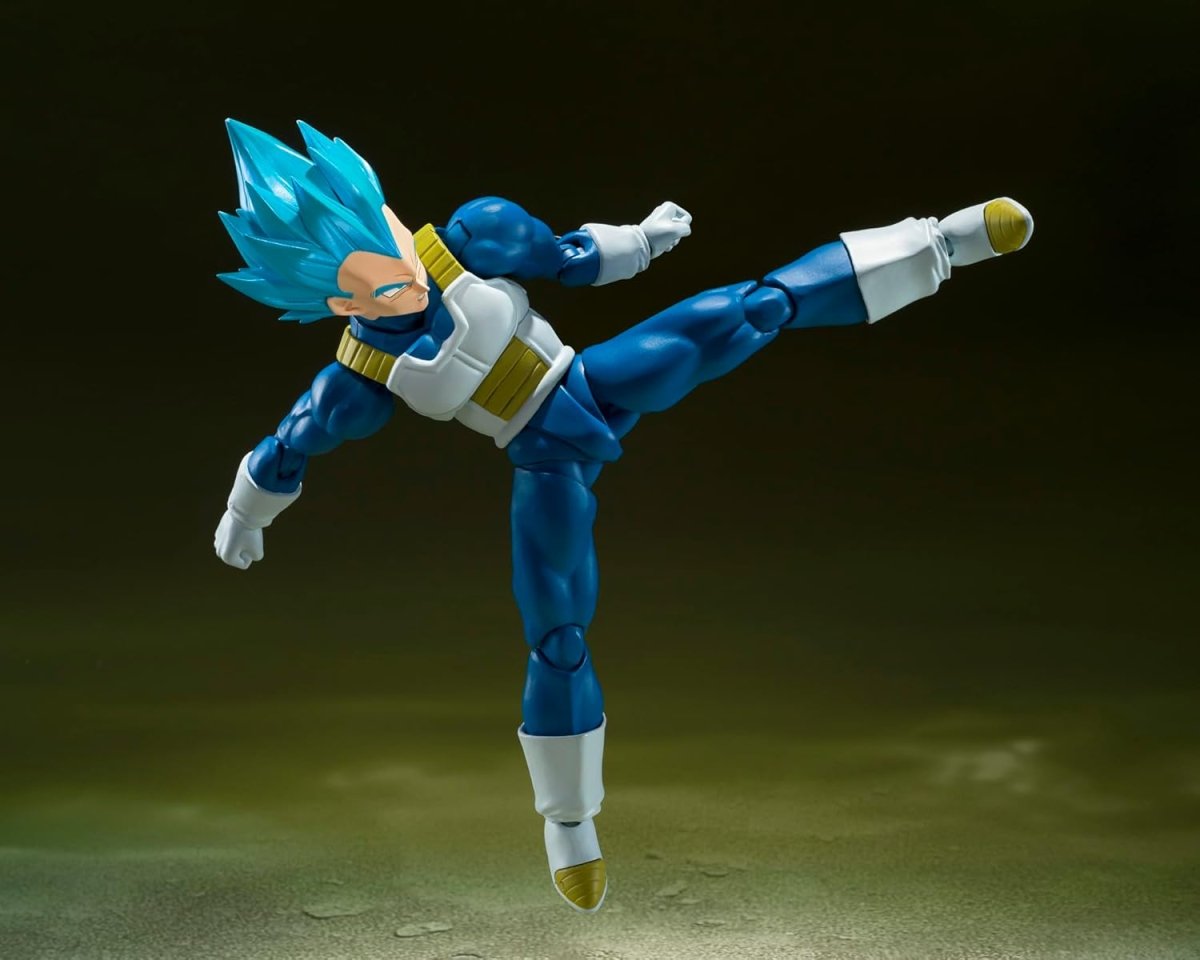 Super Saiyan God Vegeta action figure in blue and white armor performing a high kick pose