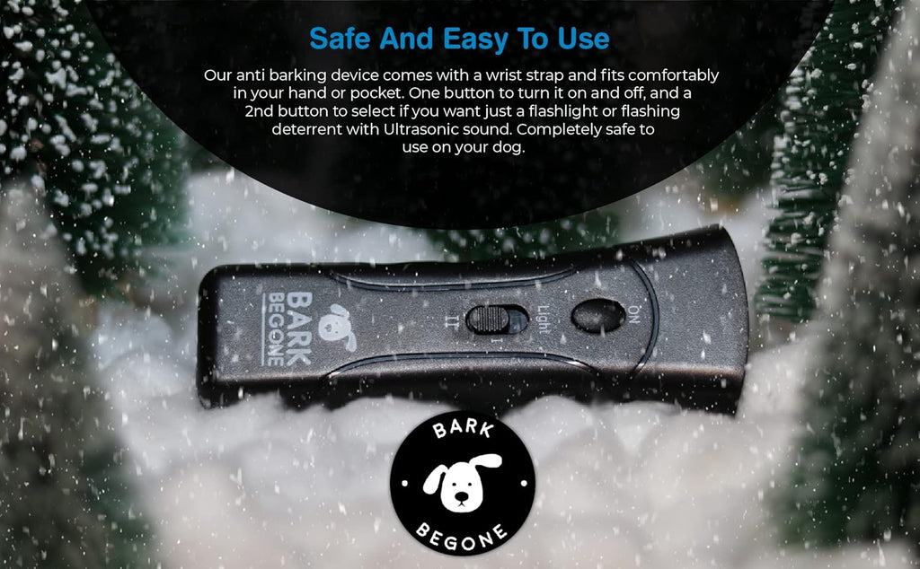 craques ultrasonic dog bark deterrent device with wrist strap and on off switch on snowy background