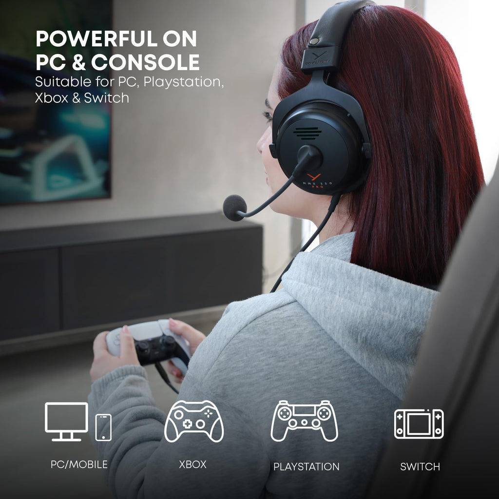 Person wearing beyerdynamic MMX 300 PRO gaming headset playing video games on a console
