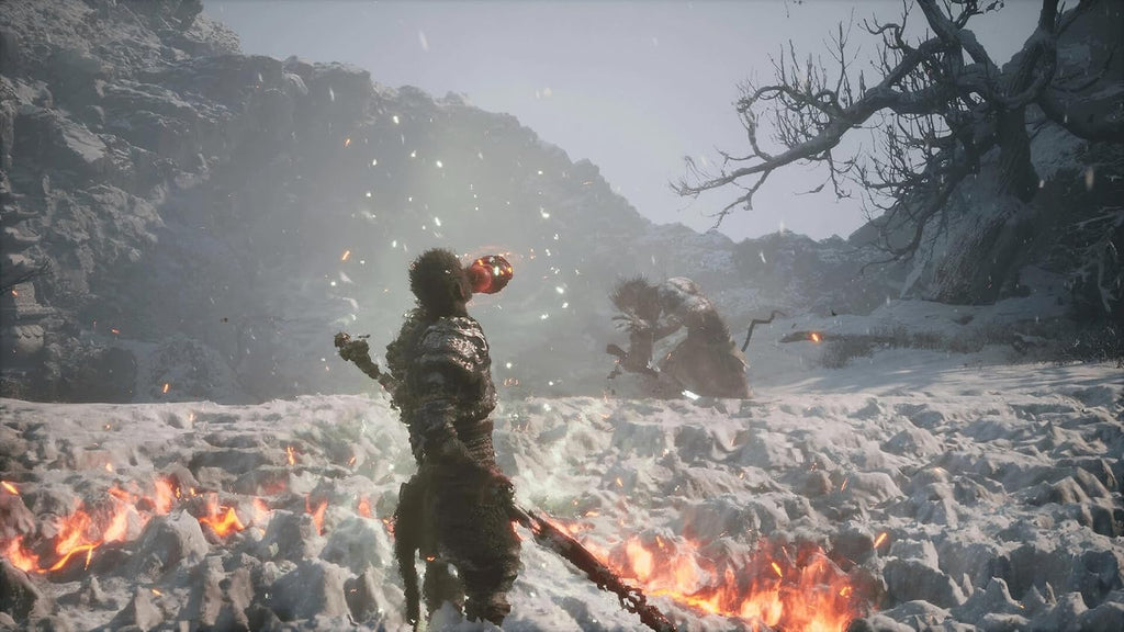 Black Myth Wukong PS5 gameplay scene with warrior in fiery snowy battlefield
