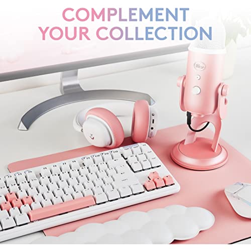 Blue Yeti USB microphone for streaming in pink set with matching keyboard and headphones on desk