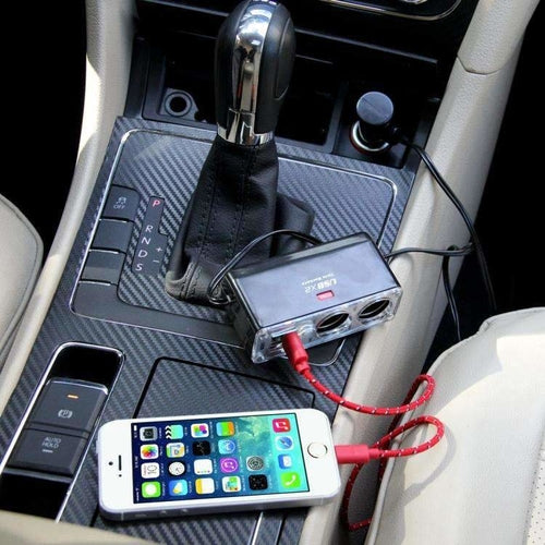 2-socket car cigarette lighter adapter connected to smartphone for charging in vehicle