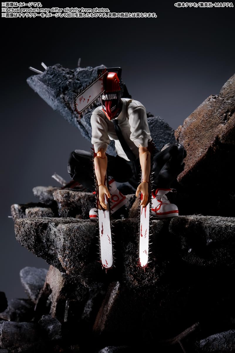 Chainsaw Man action figure sitting on rocky terrain with detailed blood-splattered chainsaws
