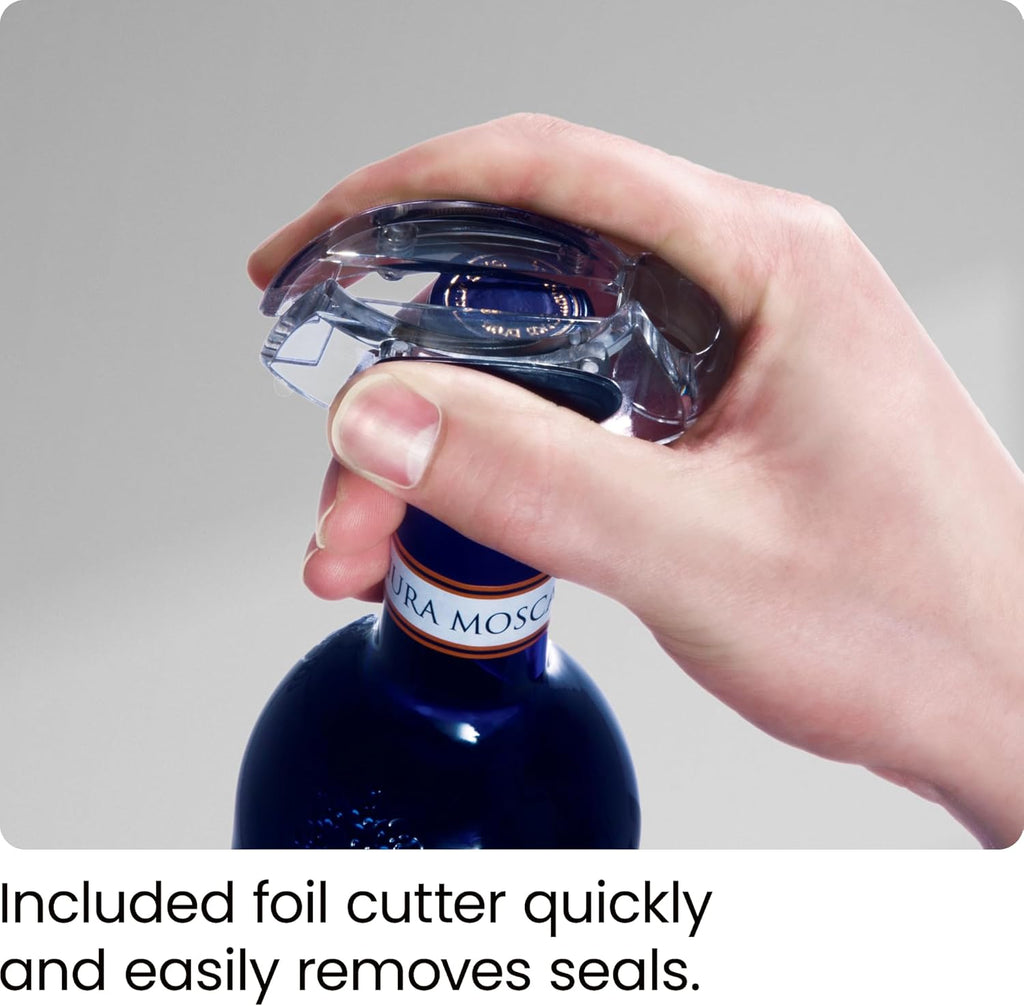 Hand using craques electric wine opener rechargeable with foil cutter on blue wine bottle