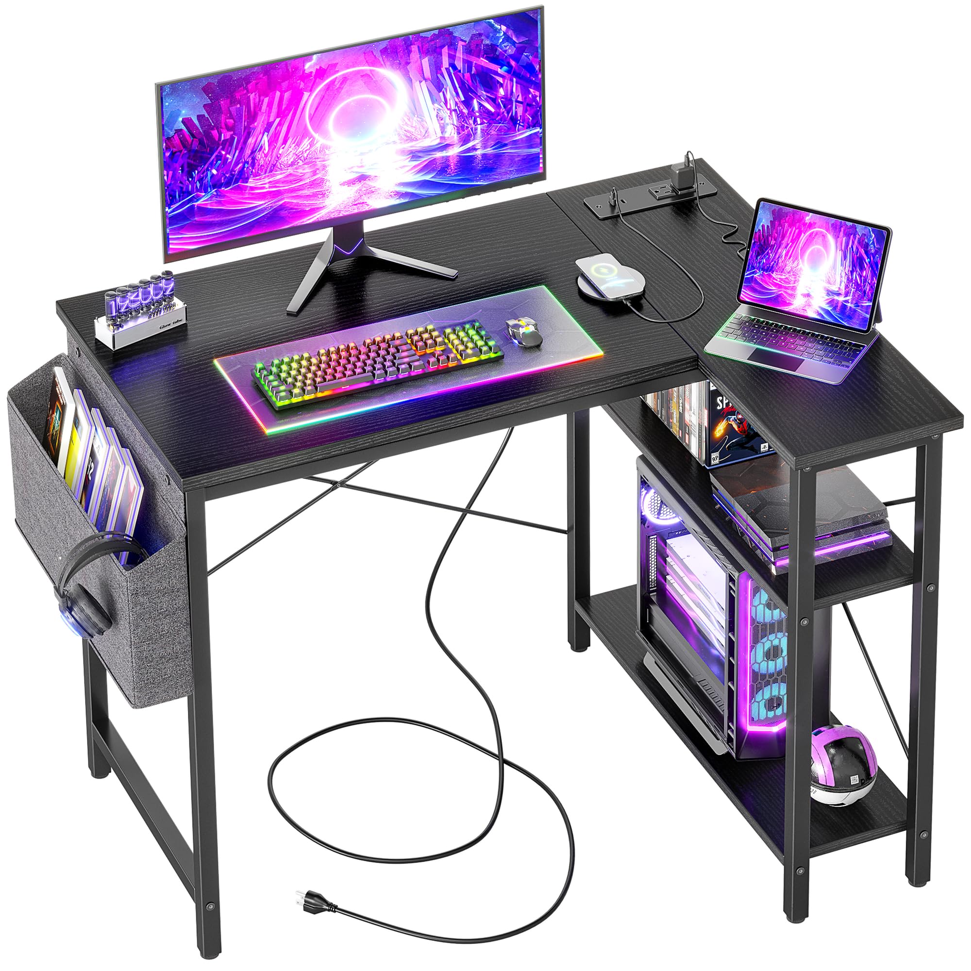 Craques computer desk with power outlets featuring a black surface, RGB keyboard, monitor, laptop, and storage shelves
