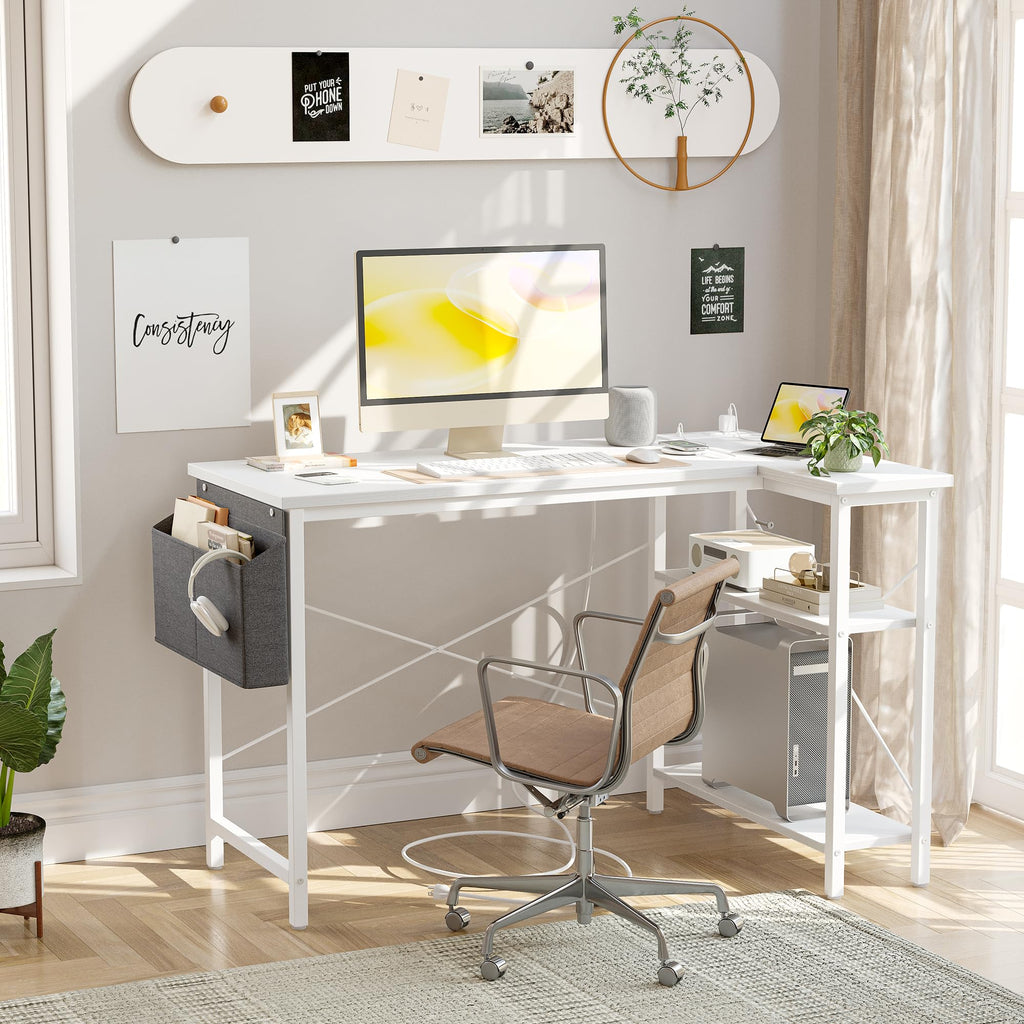 Craques white computer desk with power outlets featuring a monitor, keyboard, chair, and storage accessories in a bright home office